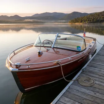 Classic wooden boat on a calm lake