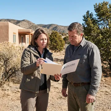 Insurance advisor reviewing wildfire coverage with homeowner