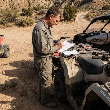 Insurance agent reviewing ATV rental coverage