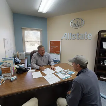 Insurance agent discussing boat coverage with owner