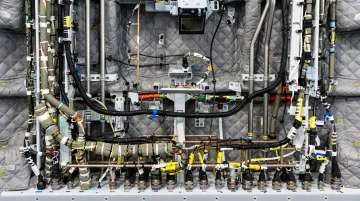 Aerospace avionics enclosure panels and PTFE wiring insulation components in aircraft assembly