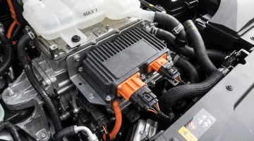 Automotive EV DC-DC converter module with reinforced plastic housing in engine bay