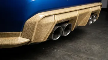 Bio-based composite automotive body panel made from flax fiber reinforced polymer