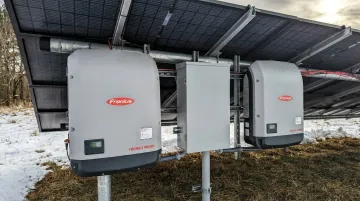 Outdoor solar inverter enclosure showing corrosion-resistant plastic housing in field installation