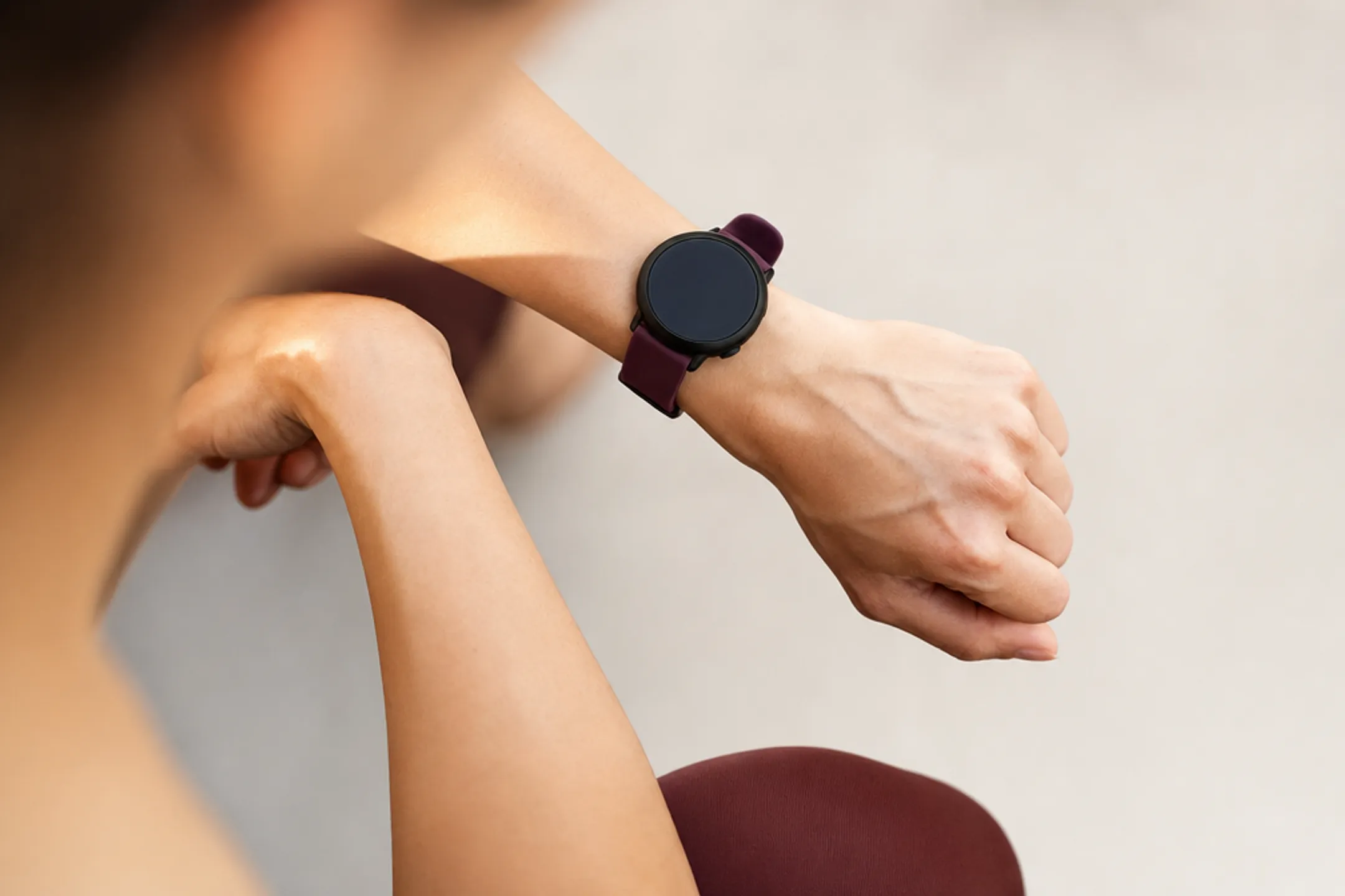 Smartwatch photographed on wrist showing scale and real-world size