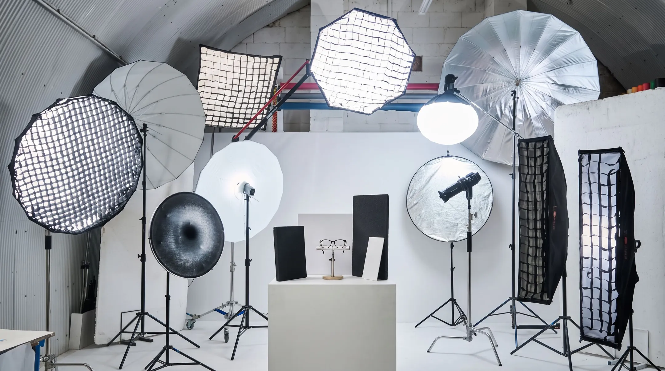 Studio lighting setup with flags reflectors controlling glasses lens glare