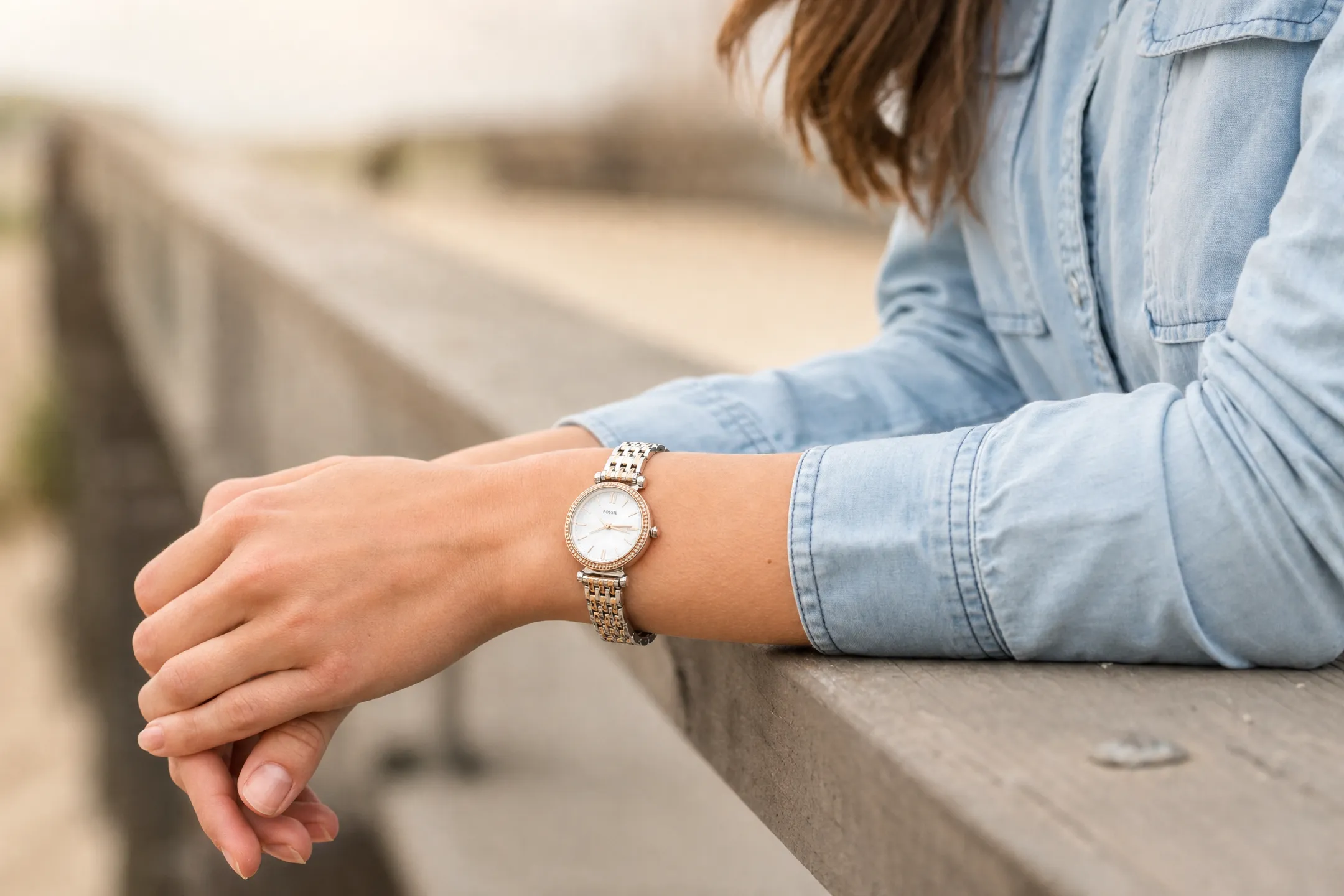 Model wearing luxury watch in natural lifestyle setting outdoors