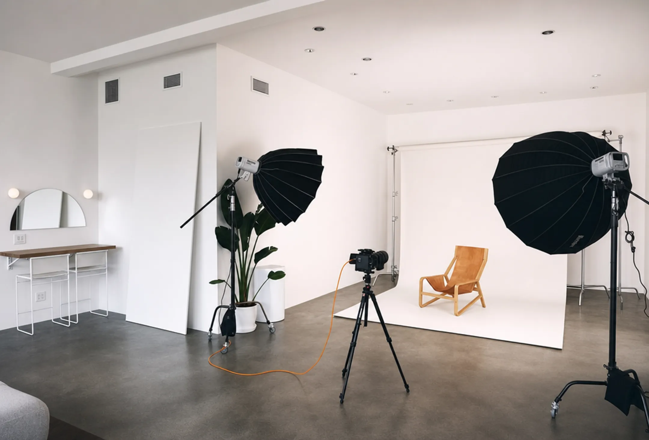 Professional NYC photography studio setup with lighting equipment and backdrop