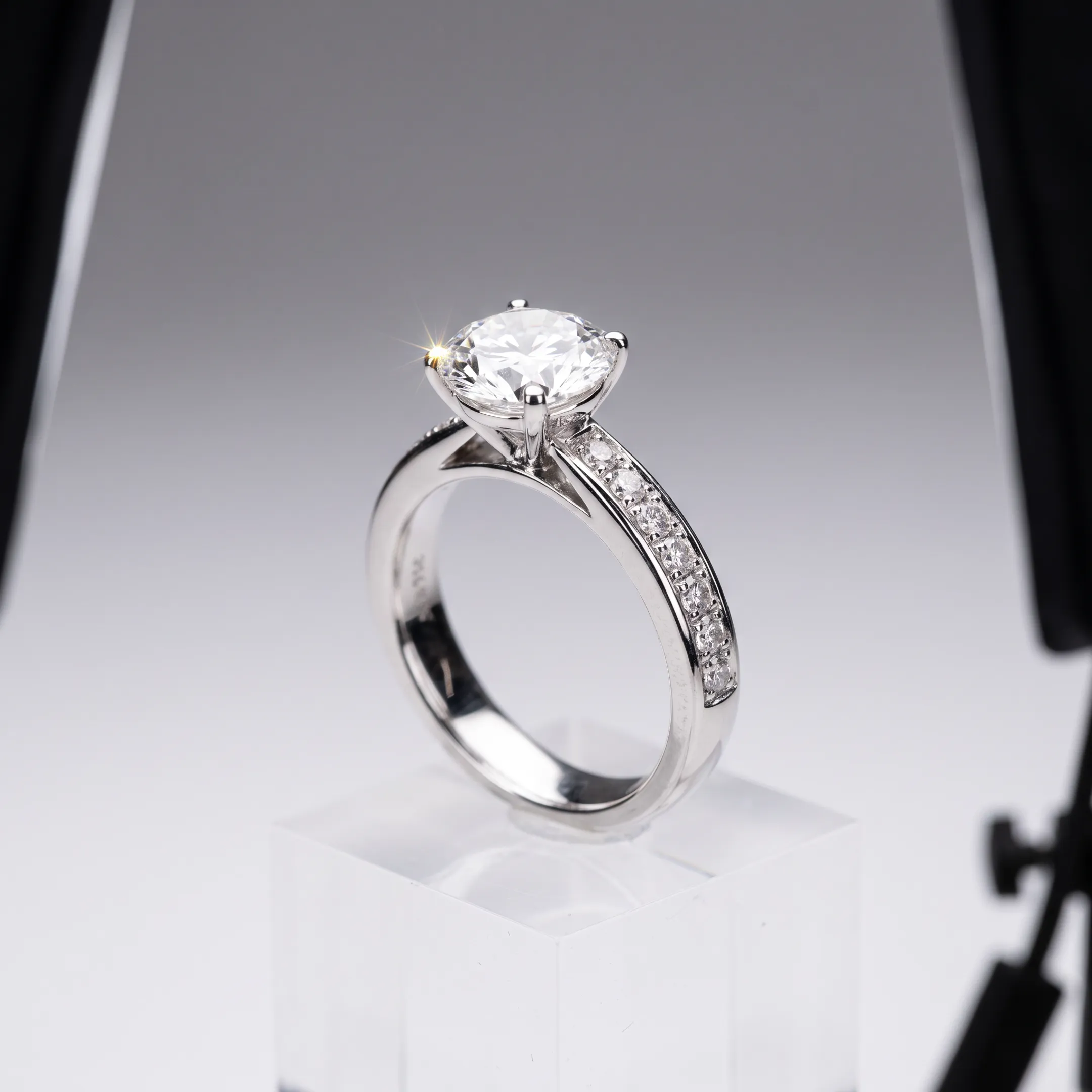 High-end jewelry retouching showcasing polished gold ring with brilliant cut diamond
