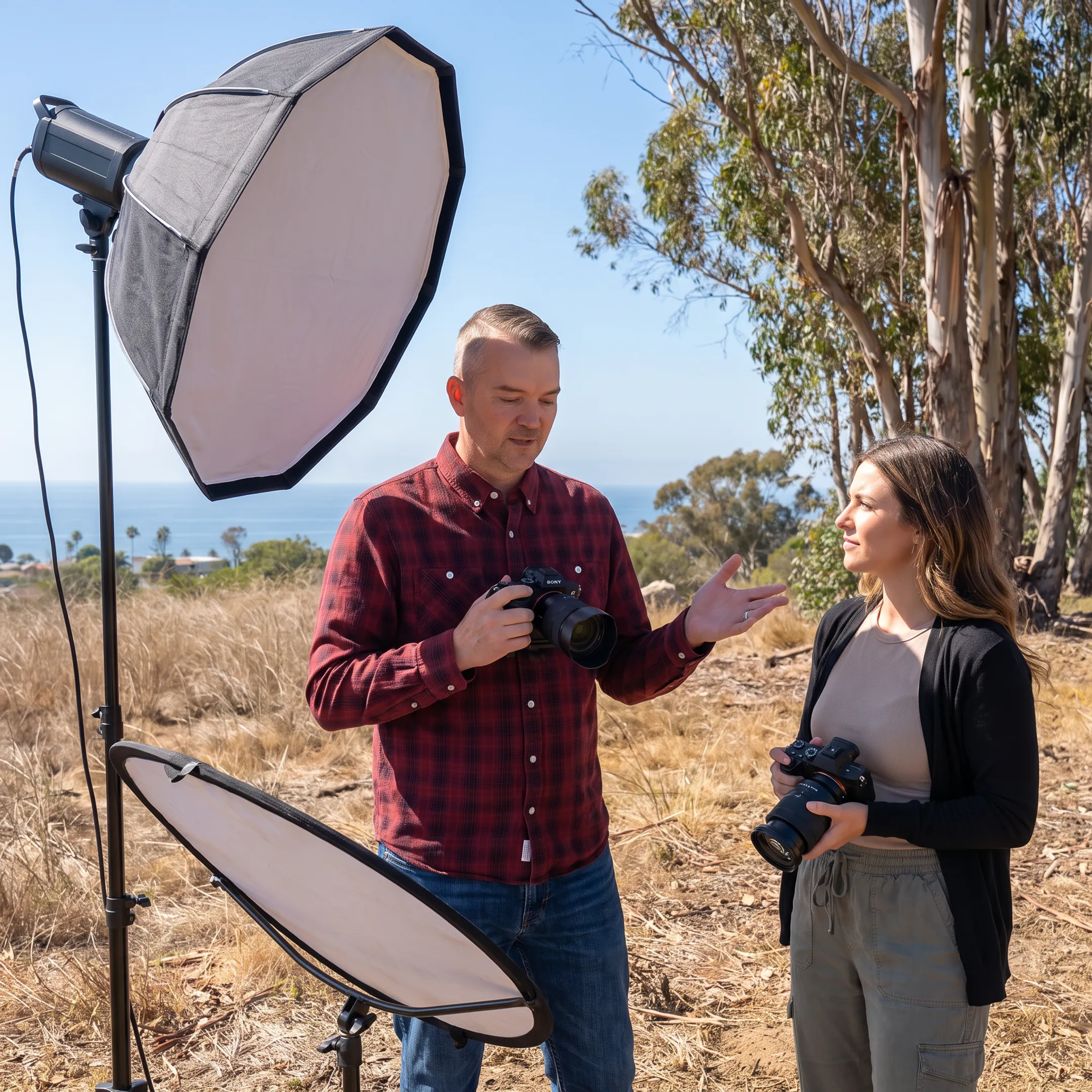 Commercial photographer setting up lighting on an outdoor location shoot