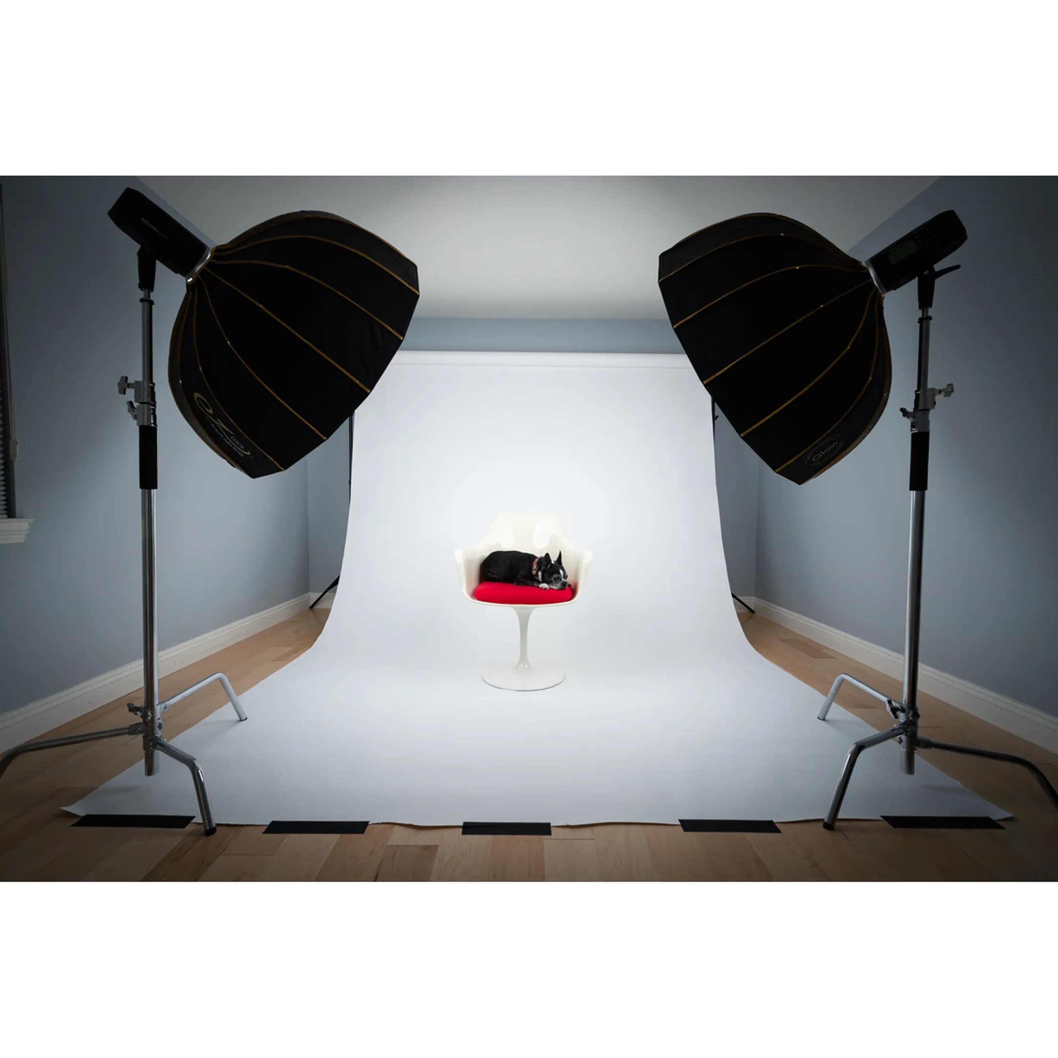 Creative director inspecting commercial product photos on monitor during a studio shoot