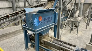Jersey Crusher Lump Buster mounted under silo discharge ahead of feeder system