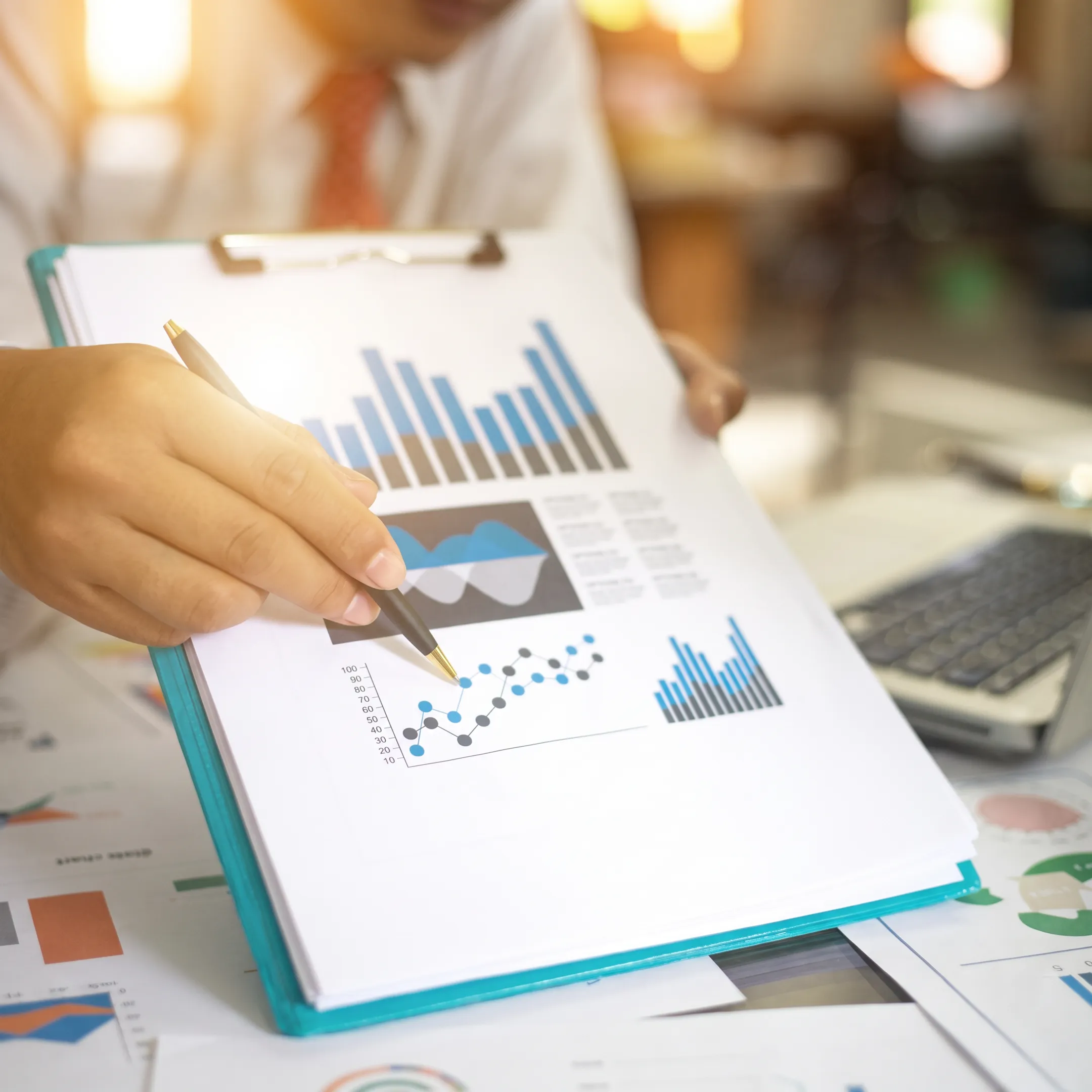 Consultant explaining financial charts to business owners