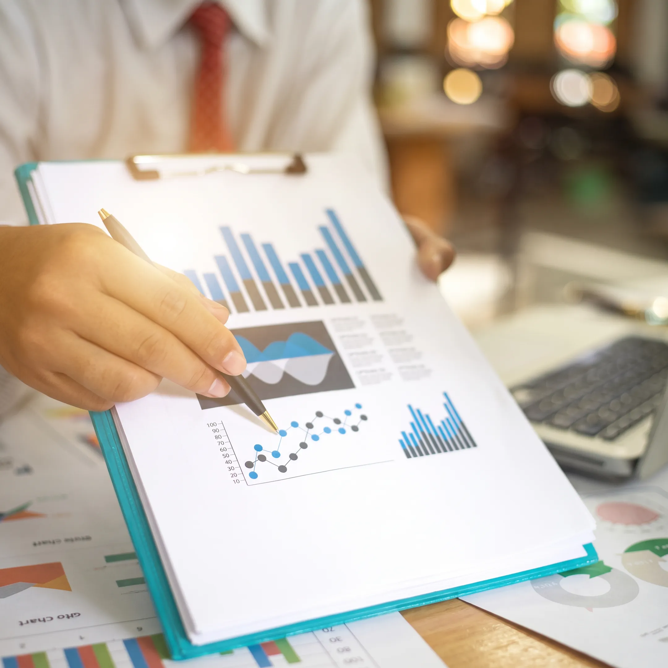 Tax professional explaining business tax planning documents