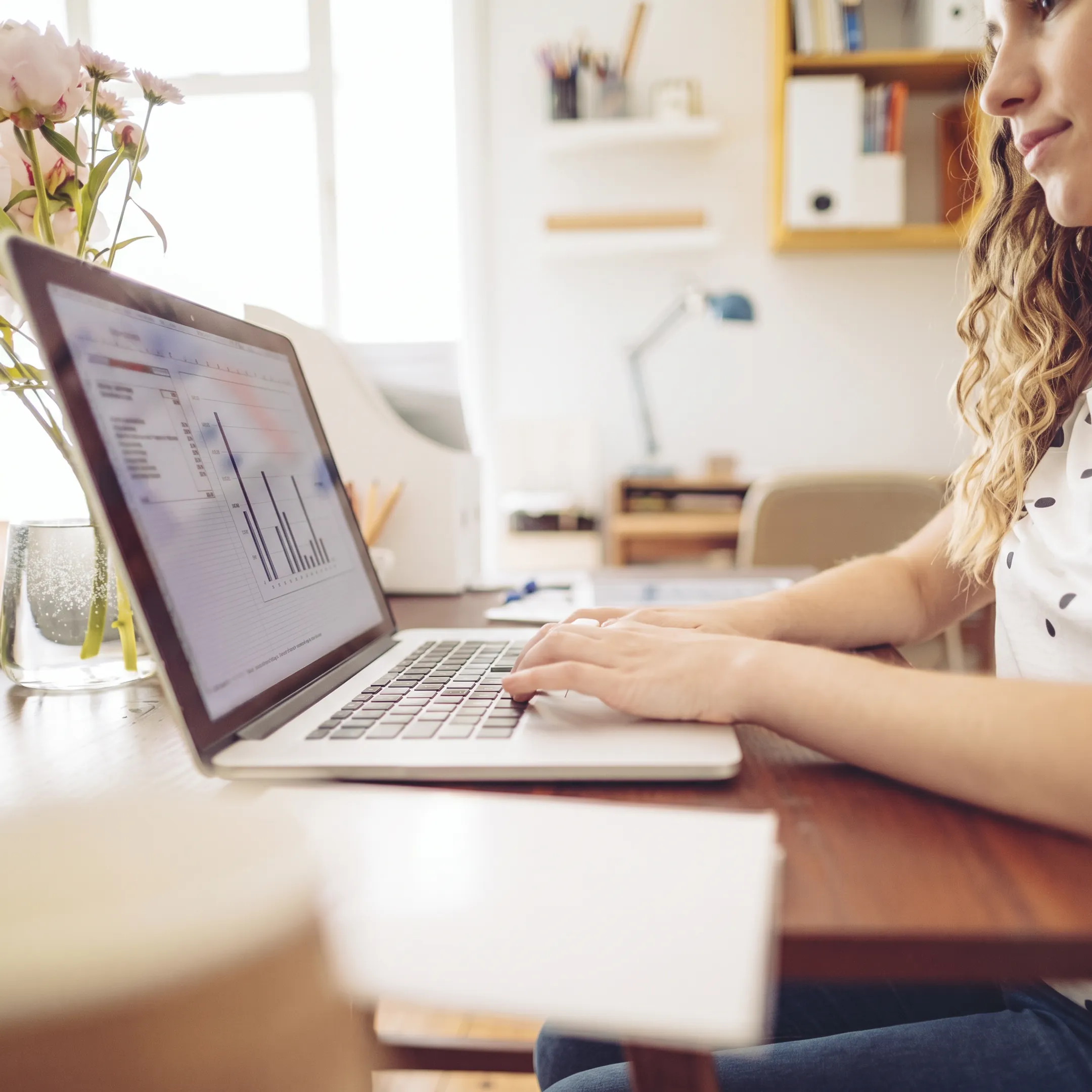 Small business owner discussing bookkeeping reports with an accountant
