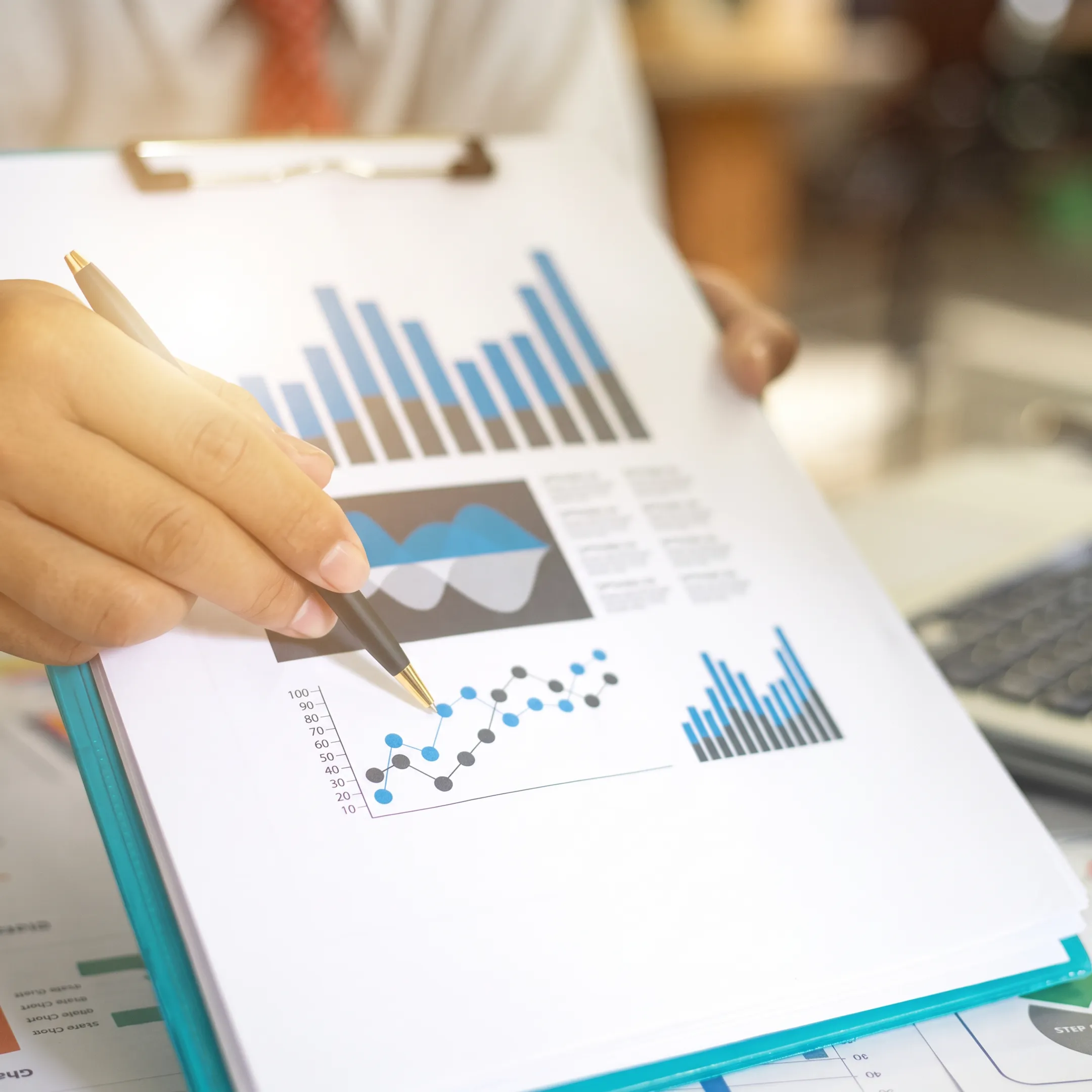 Financial advisor discussing bookkeeping reports with a business owner