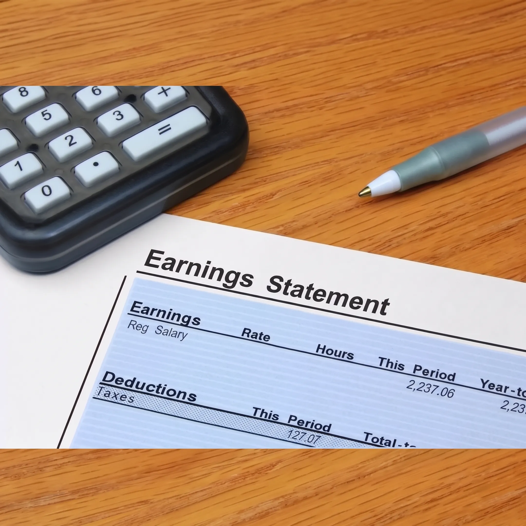 Tax professional explaining LLC tax planning documents to a business owner