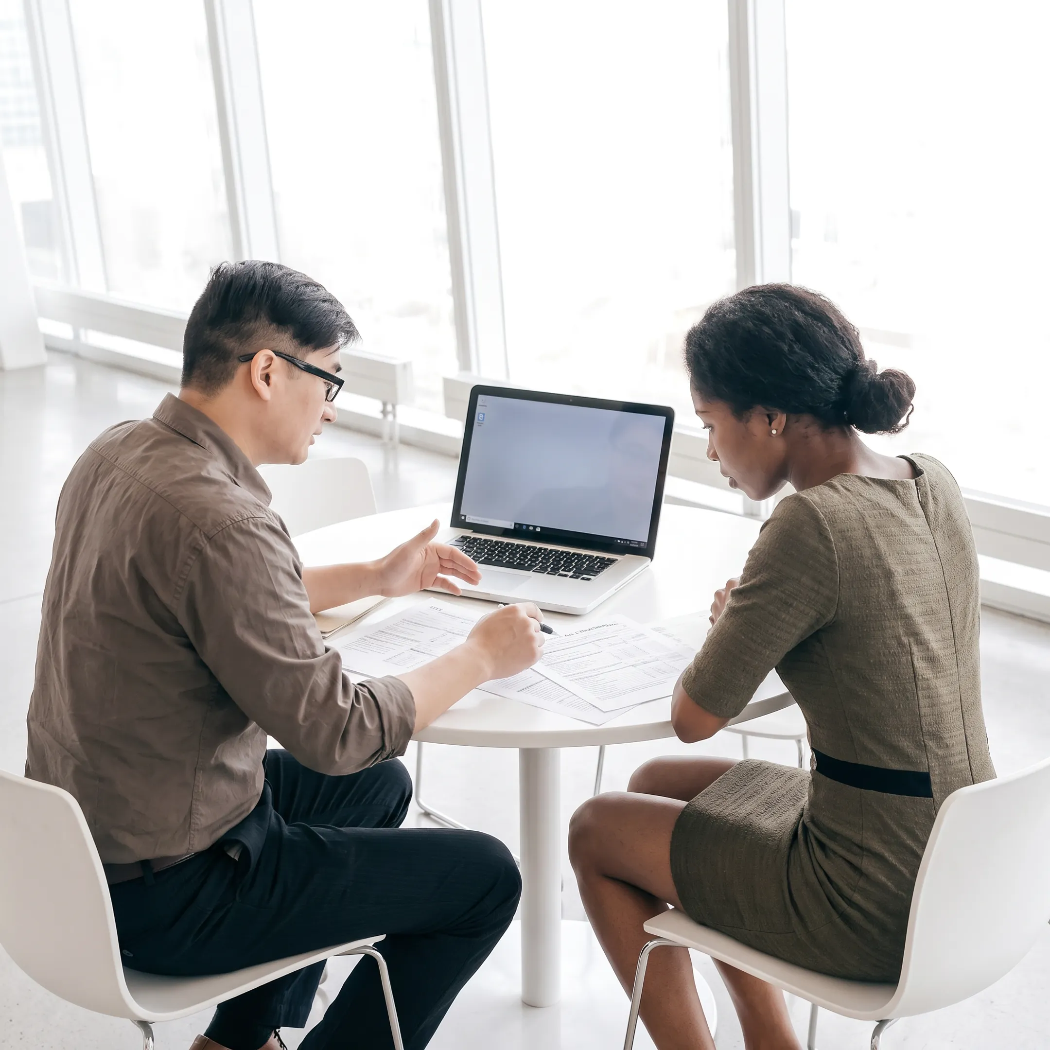Advisor explaining tax planning documents to an individual client