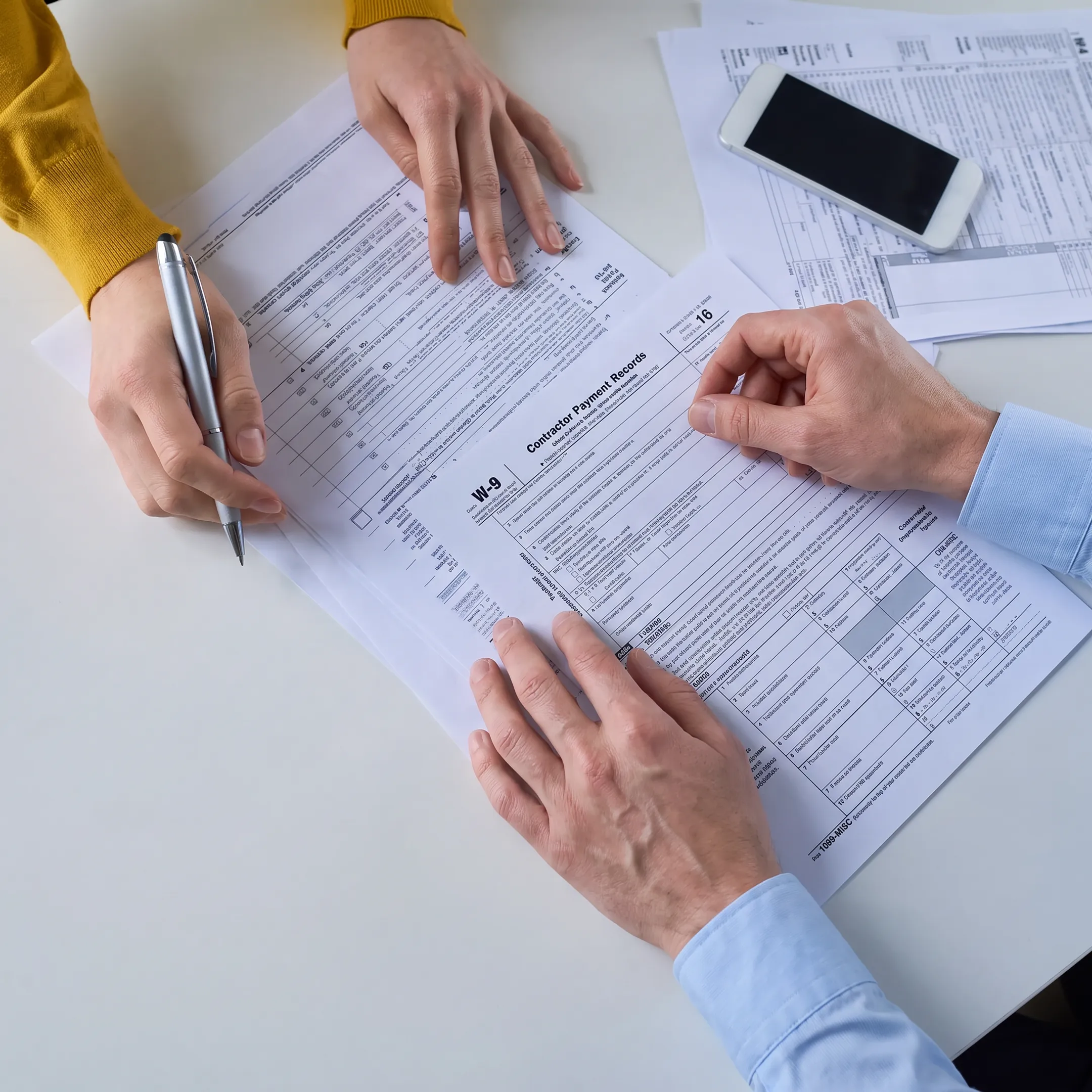 Tax professional organizing contractor records for 1099 filing