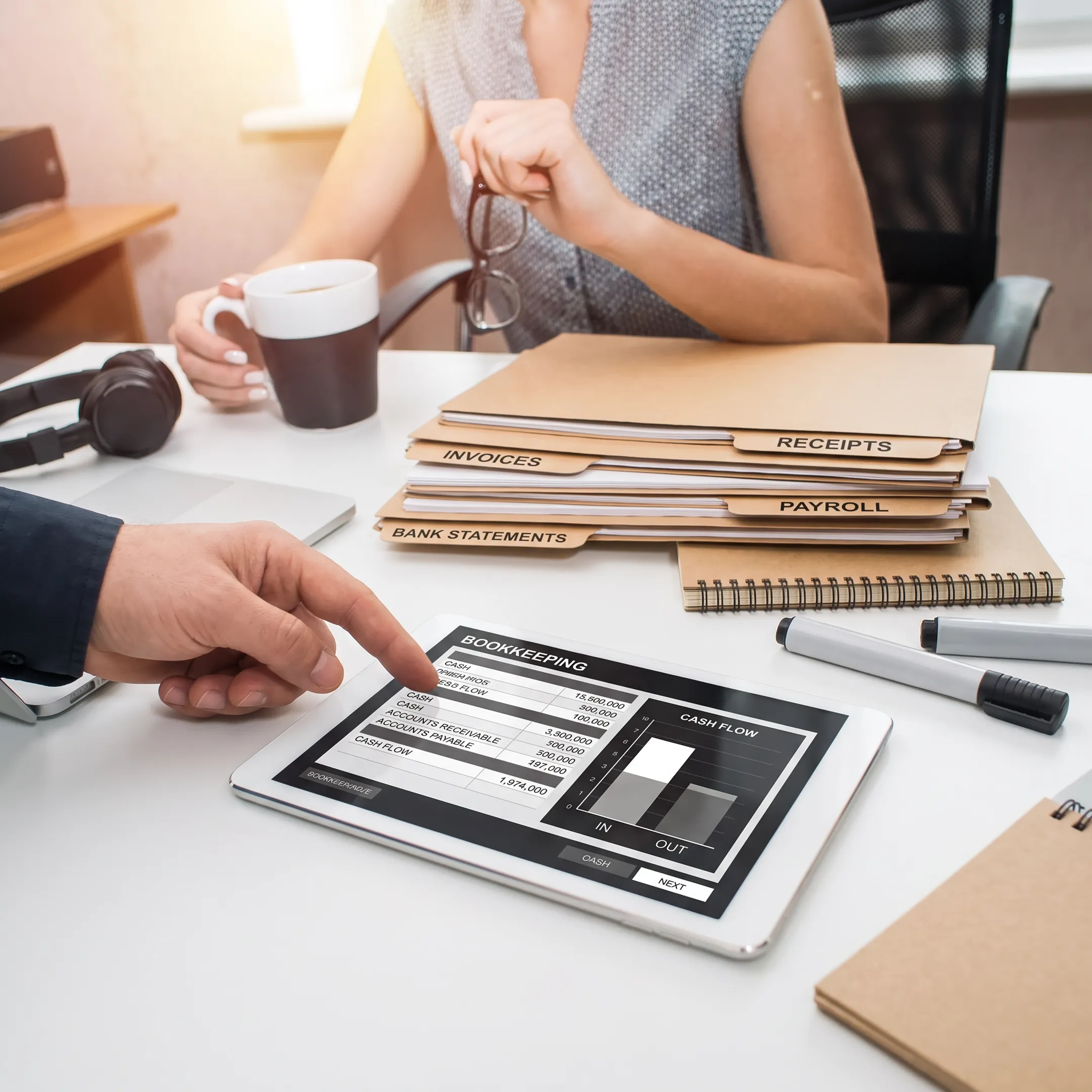 Organized accounting documents and bookkeeping software on a desk