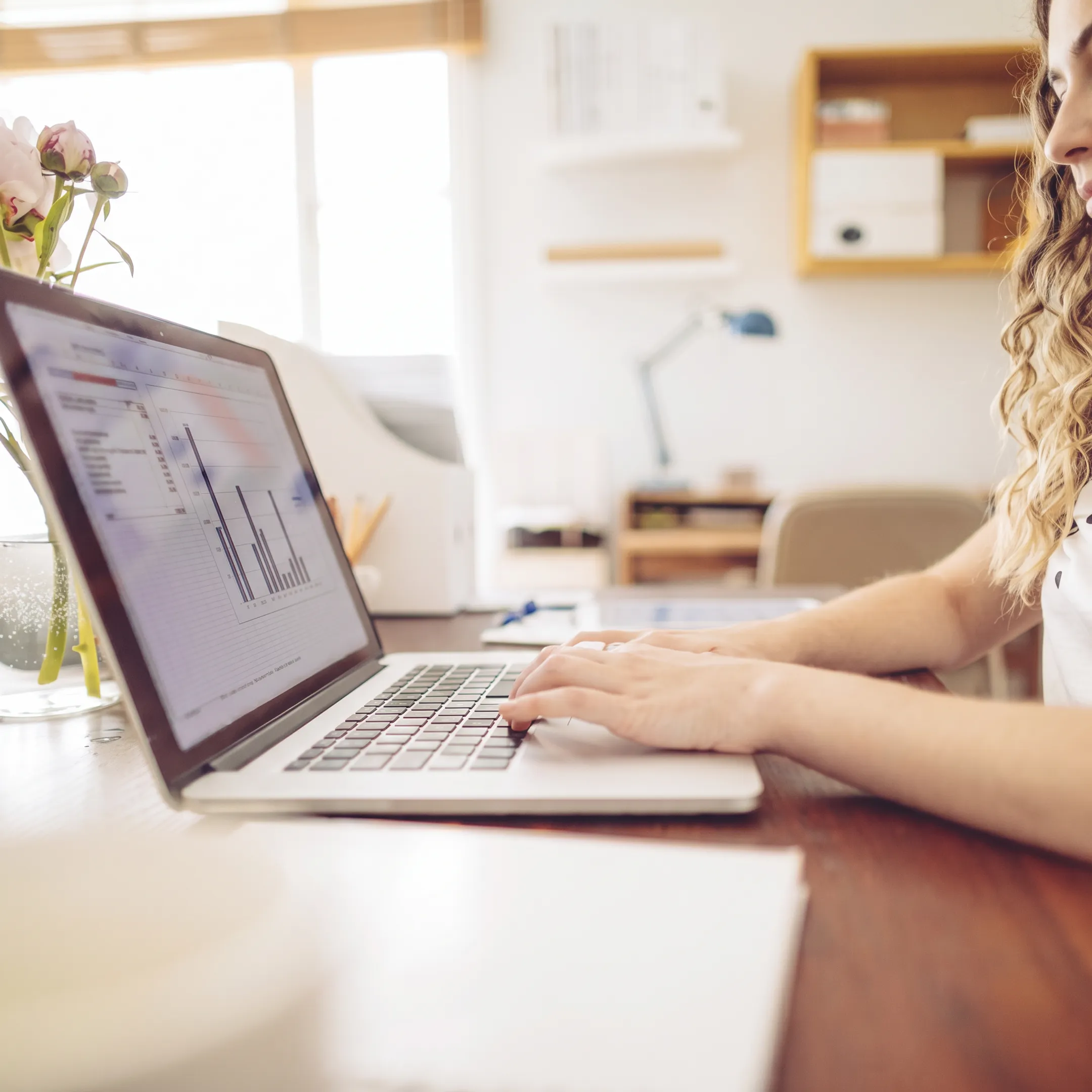Accountant reviewing organized bookkeeping records with a business owner