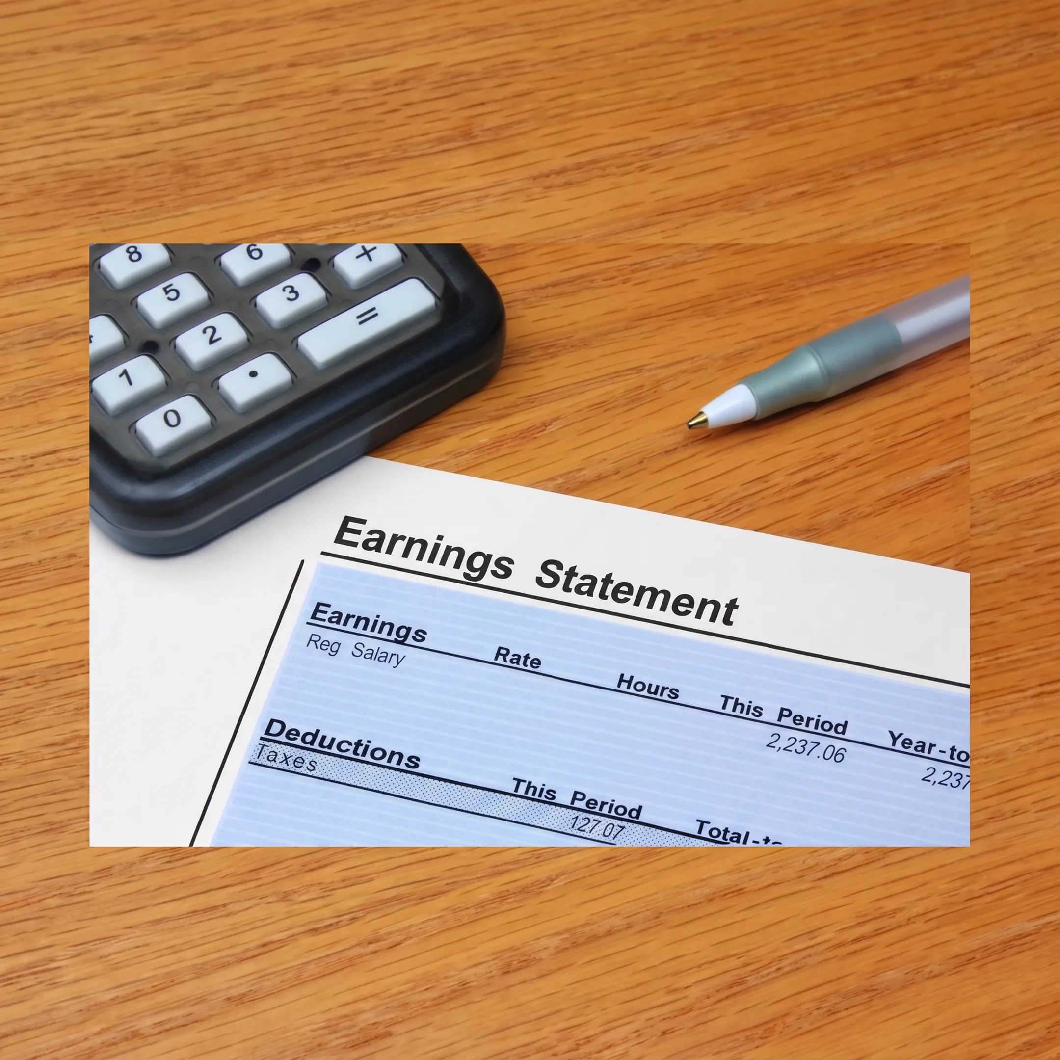 Advisor explaining payroll tax debt documents to a business owner