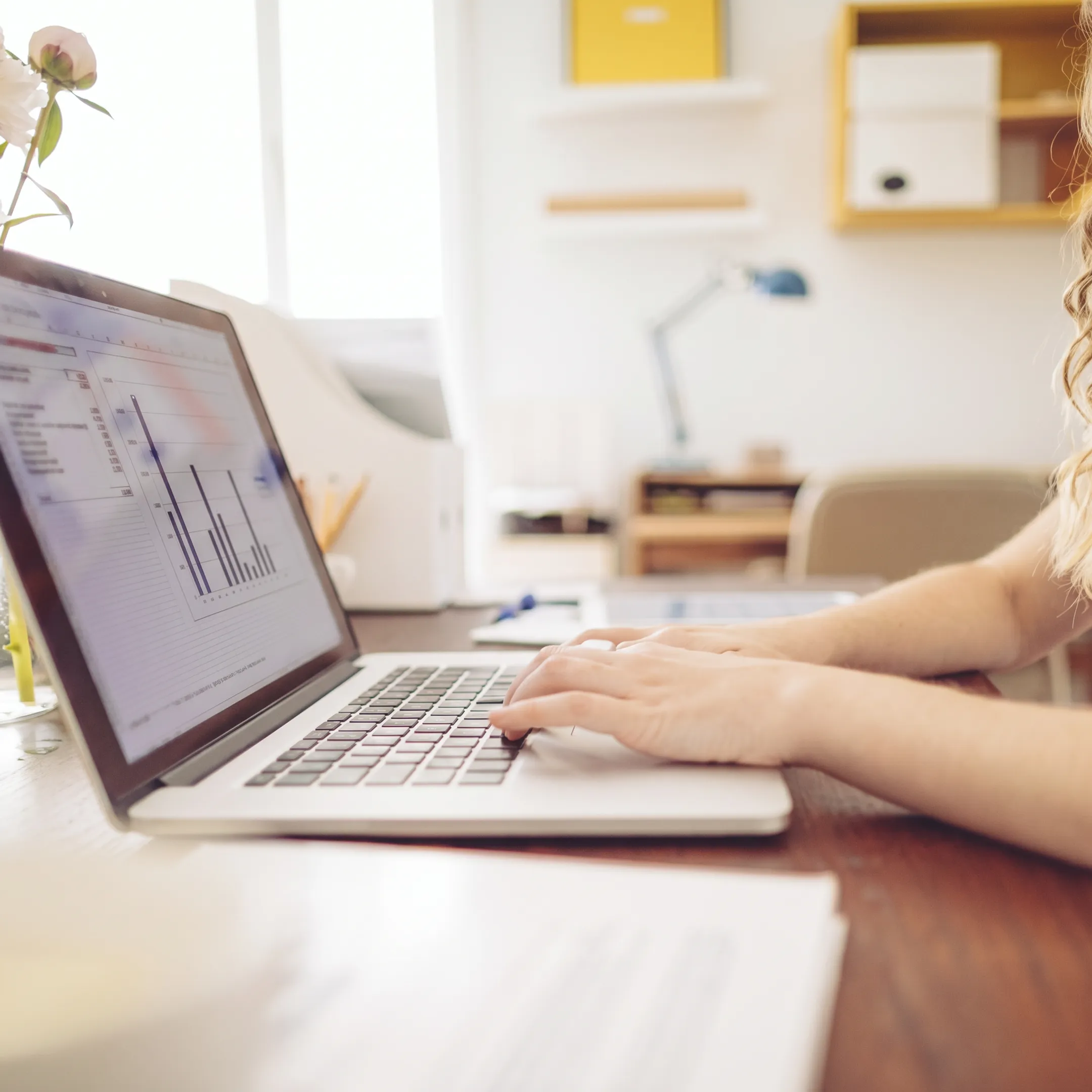 Accounting professional organizing business records on a laptop