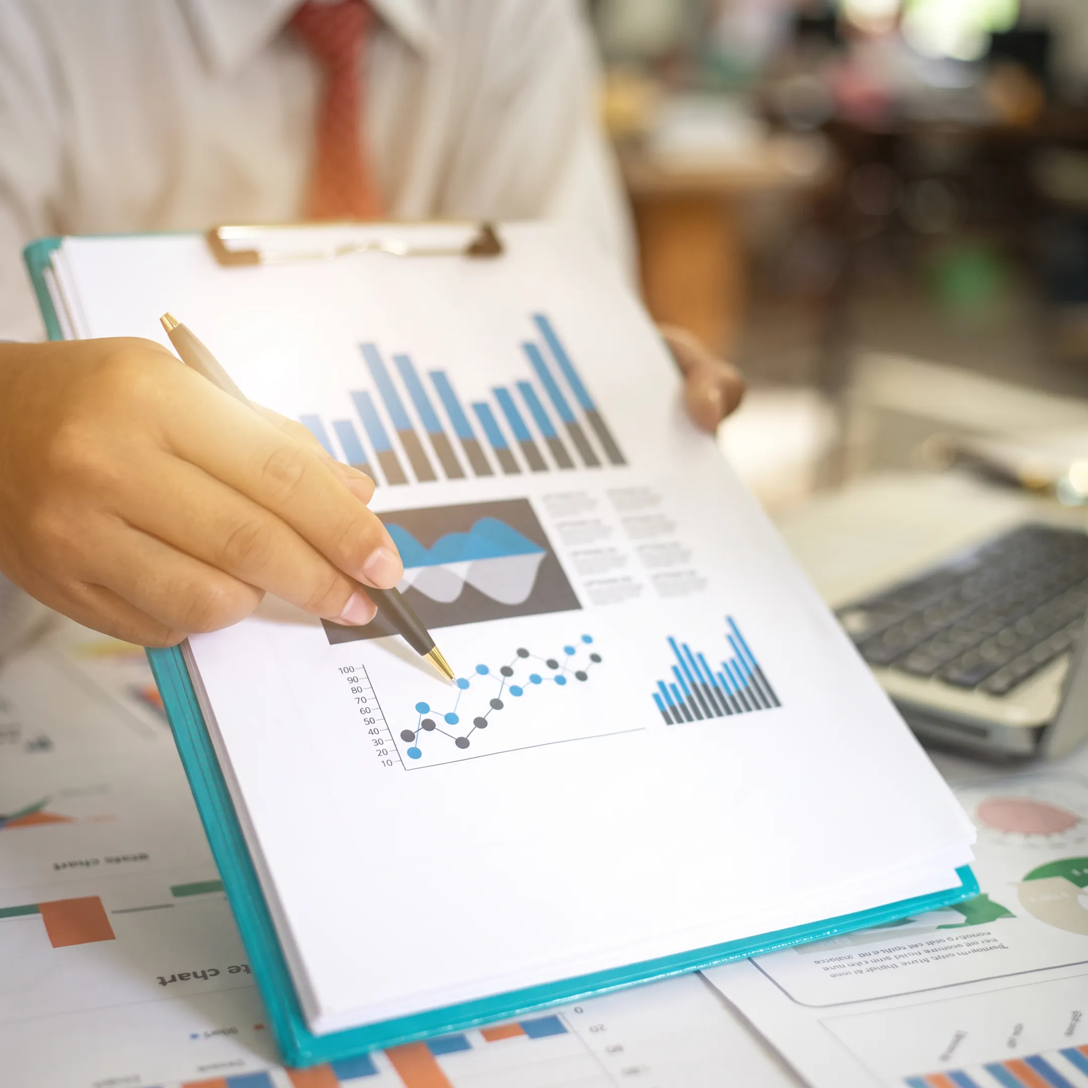 Construction business owner reviewing organized project accounting reports