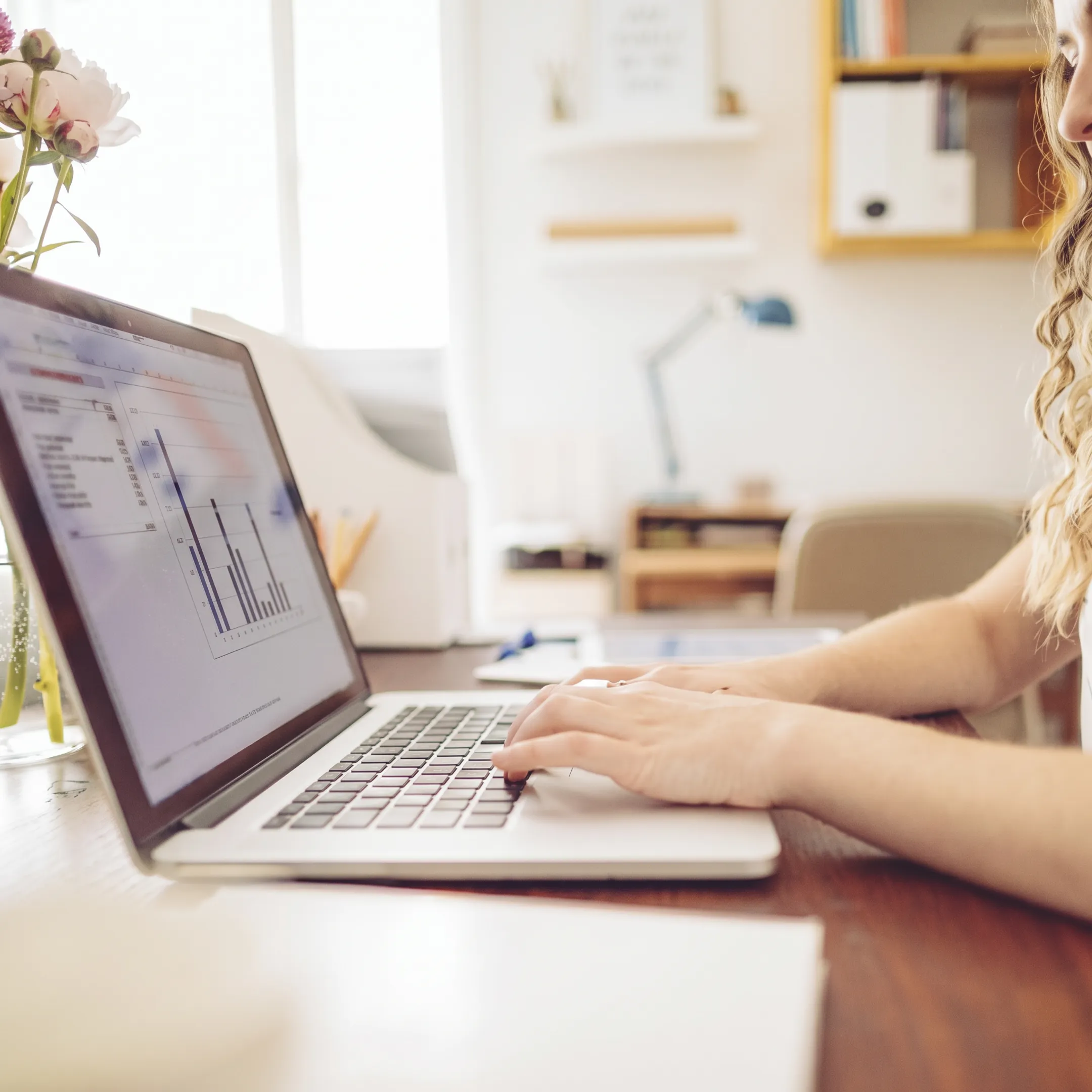 Bookkeeper reviewing organized financial records for a freelancer