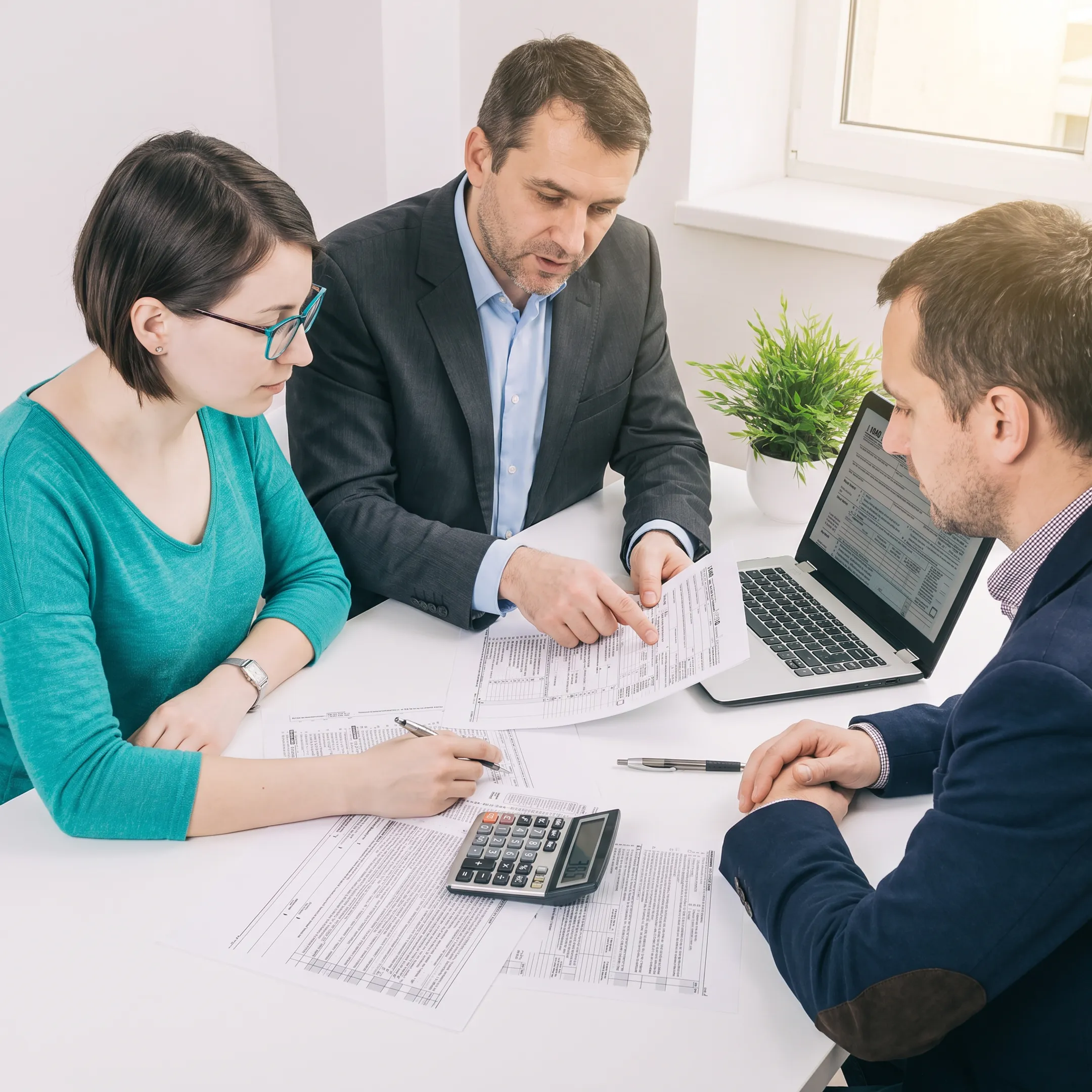 Advisor explaining composite tax return details to clients