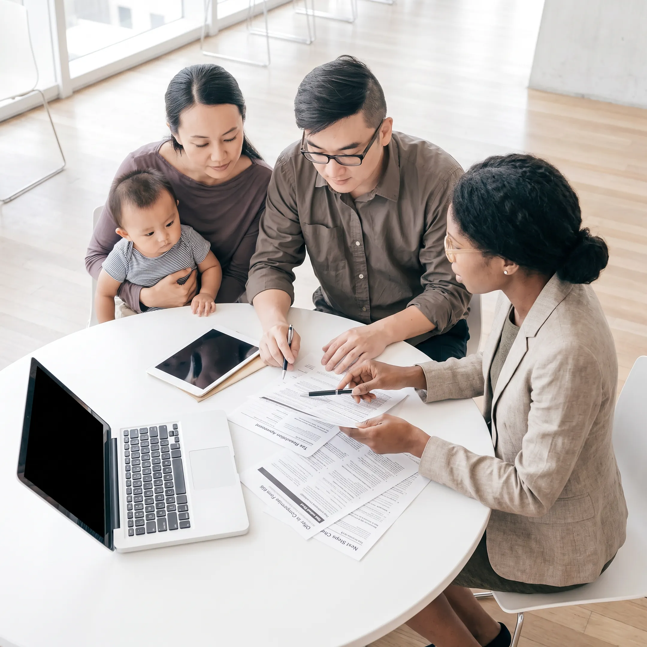 Advisor explaining IRS tax resolution documents to a client
