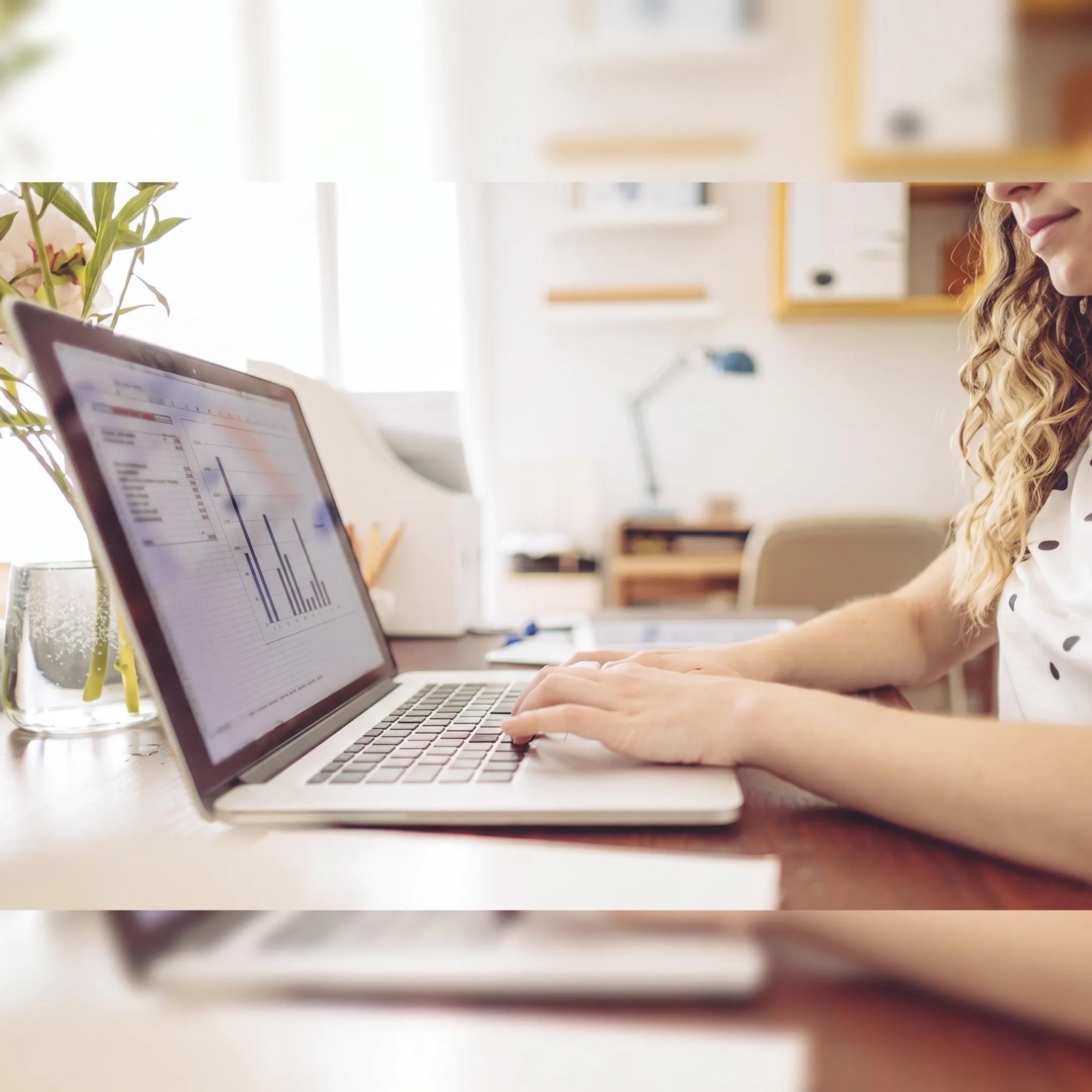 Financial professional organizing bookkeeping documents and digital records