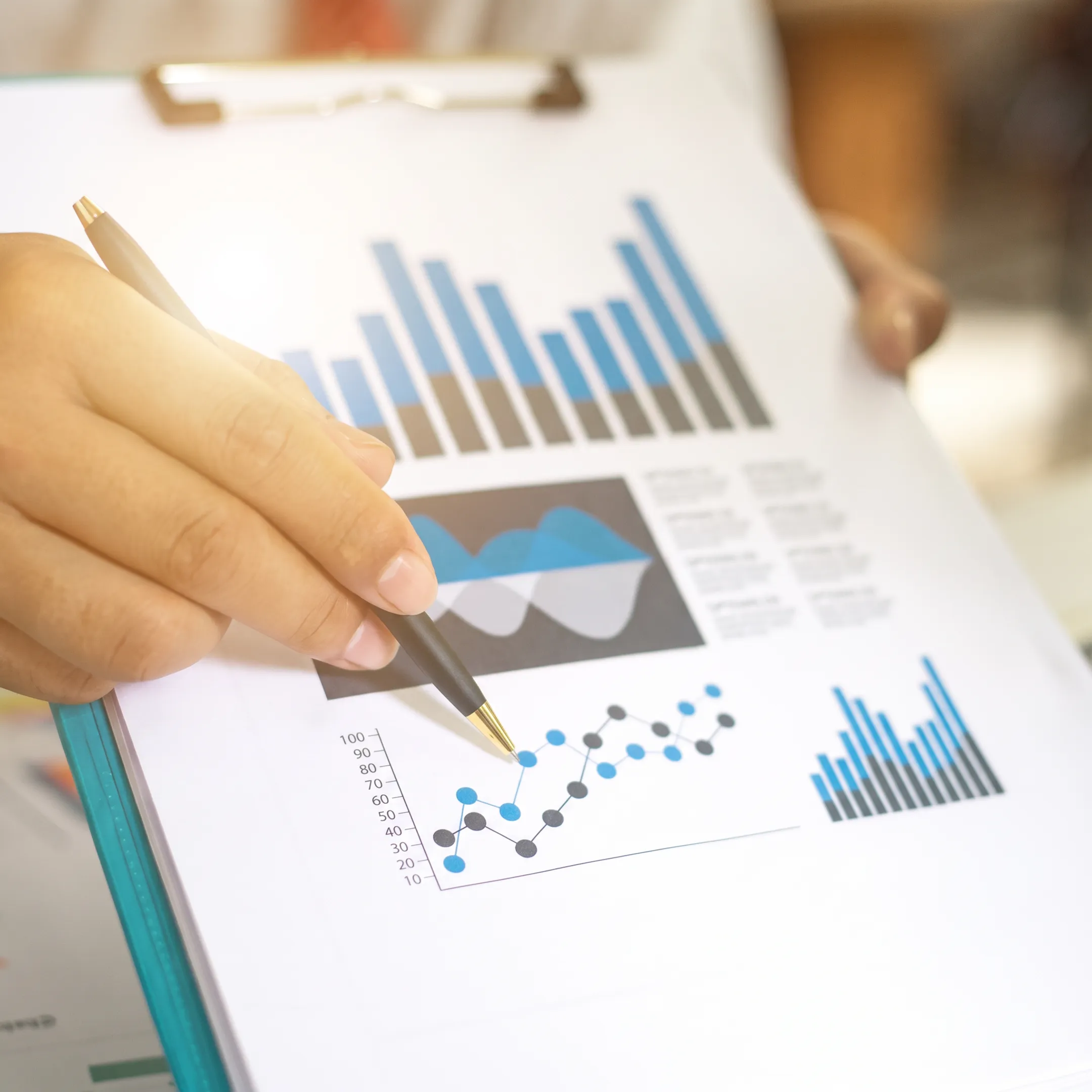 Business owners reviewing financial forecast reports