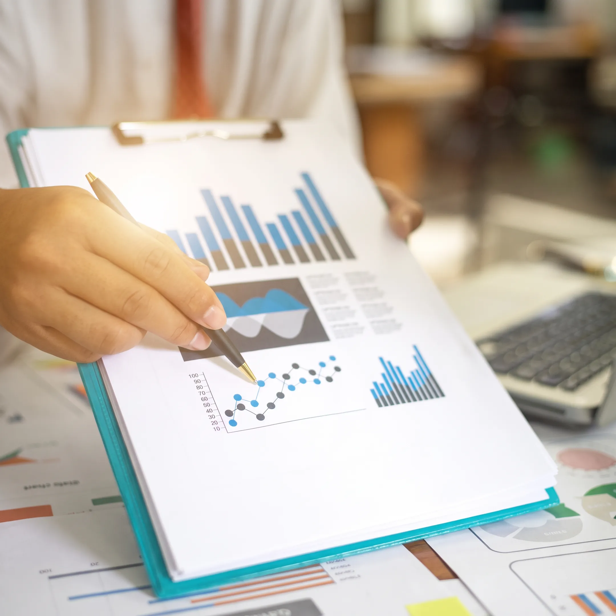 Advisor reviewing a small business budget with an owner at a desk