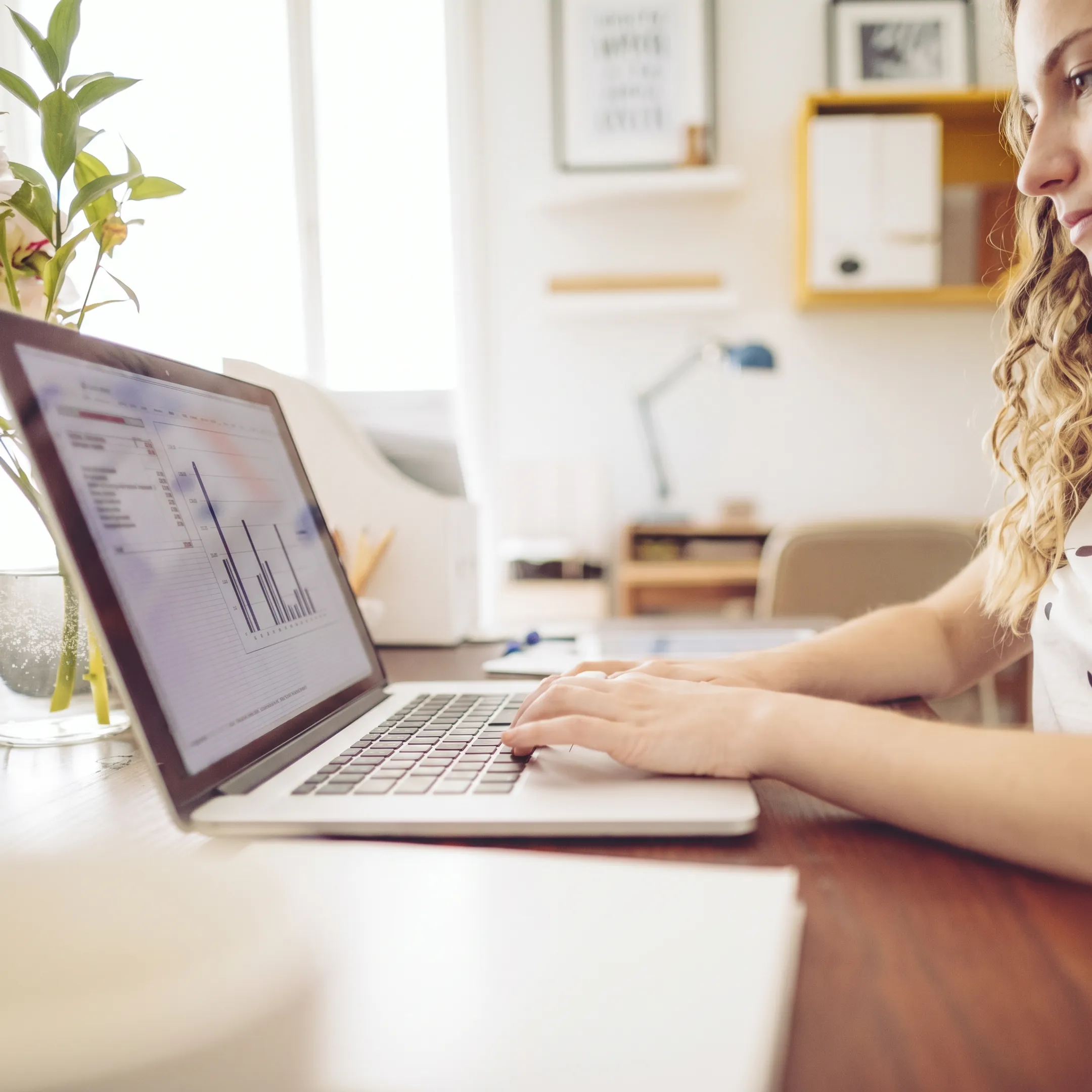 Financial professional organizing retail bookkeeping documents and reports