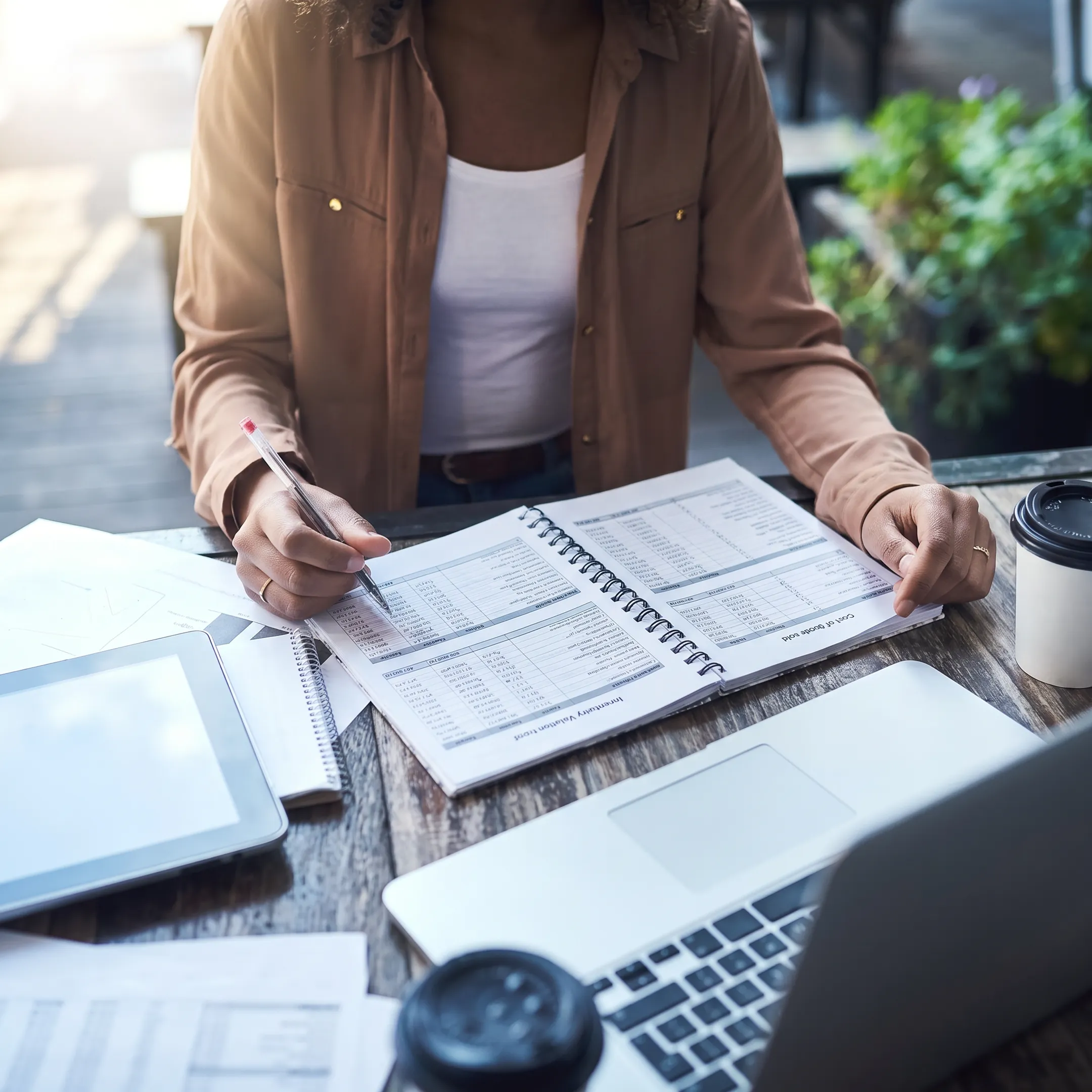Financial advisor explaining inventory accounting reports to a business owner