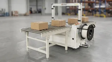Automatic corrugated strapping machine with conveyor system and strap feed mechanism