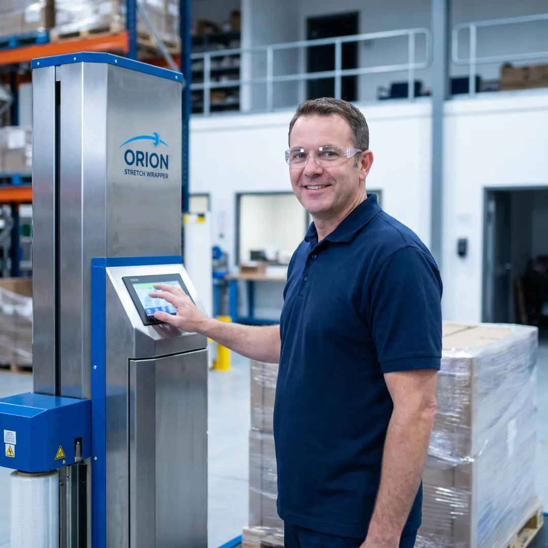 Technician reviewing stretch wrapper setup