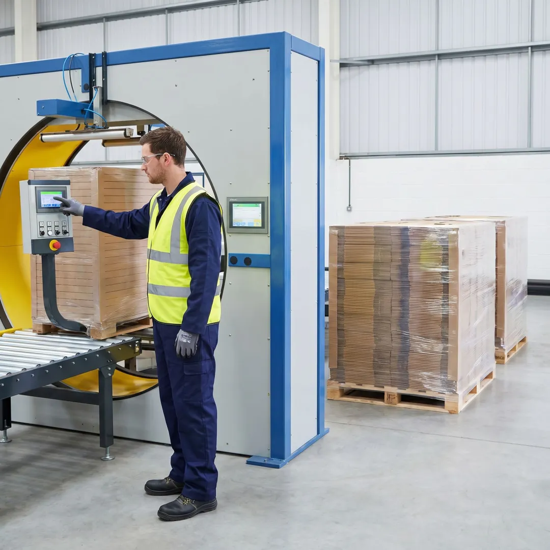 Technician inspecting a pallet stretch wrapper