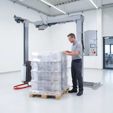 Technician reviewing shrink film packaging application