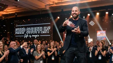 Jon Dorenbos performing magic during a live corporate keynote presentation