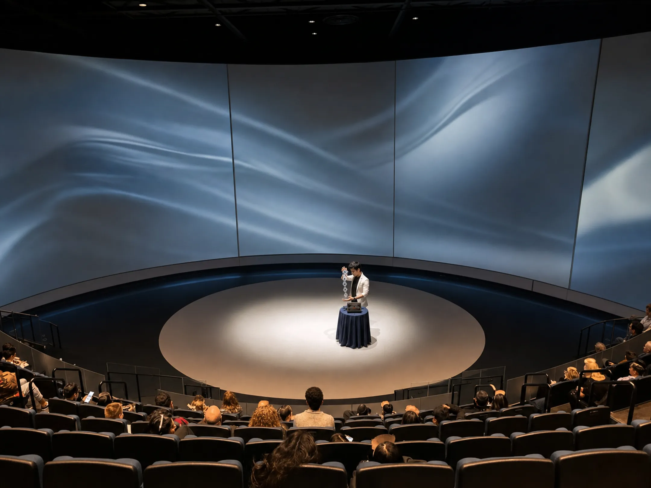 Motivational keynote speaker performing live magic trick on stage