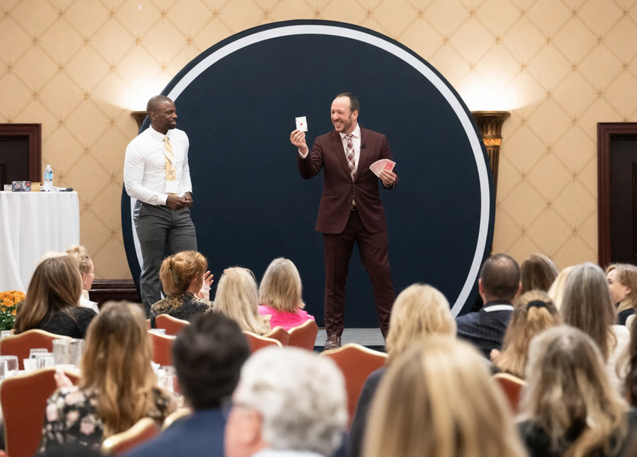 Former NFL athlete performing magic on corporate keynote stage