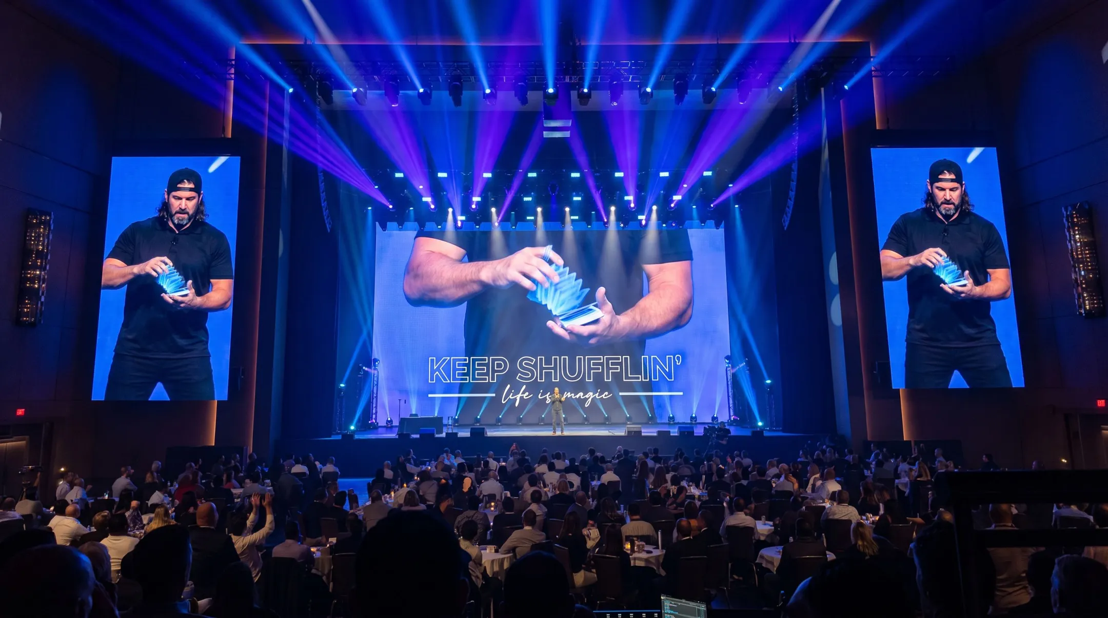 NFL long snapper transitioning to magician and motivational speaker on stage