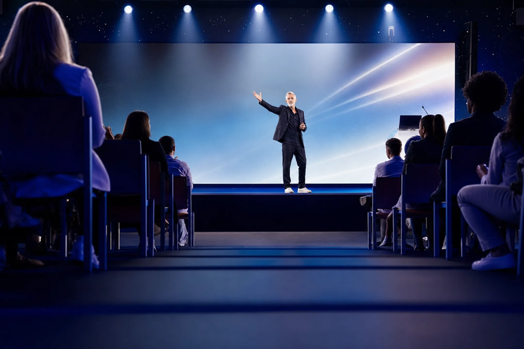 Professional keynote speaker addressing audience on corporate conference stage