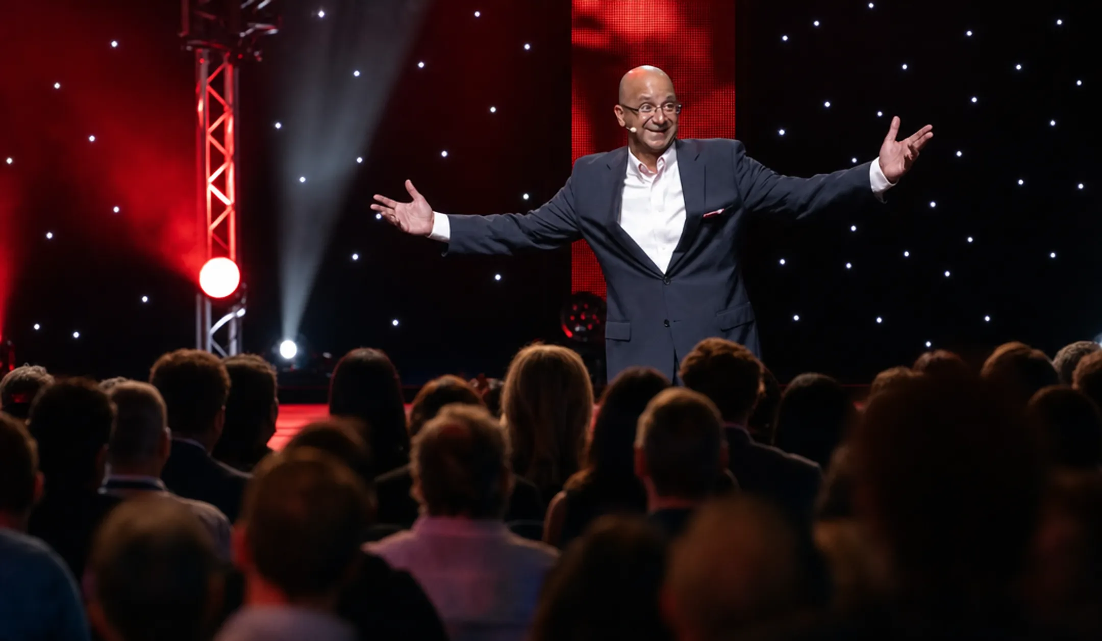 Professional keynote speaker performing on stage with engaged audience