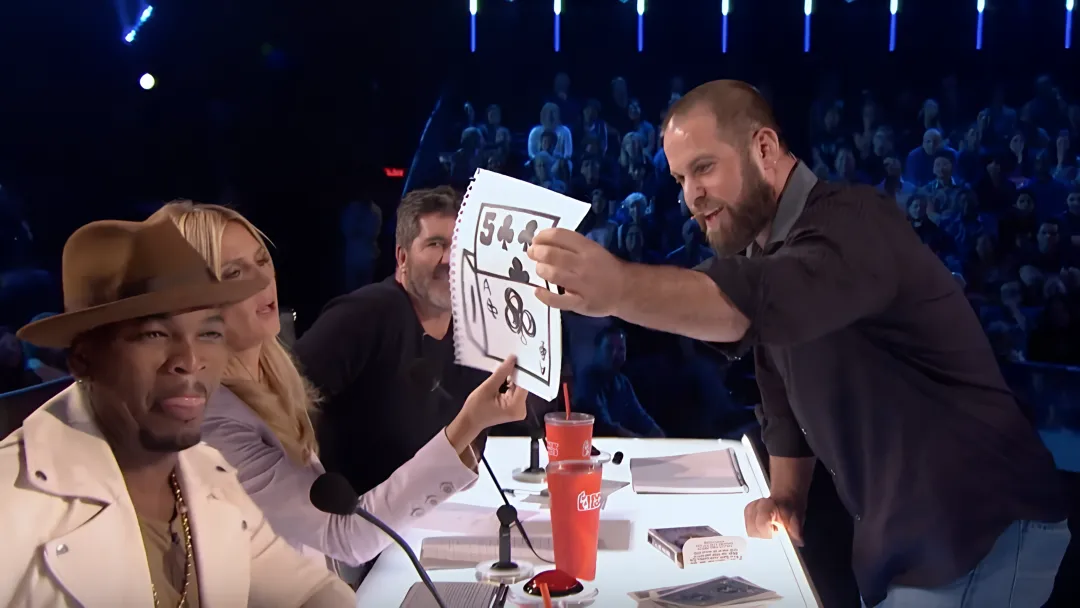 Jon Dorenbos performing signature magic and storytelling keynote on stage
