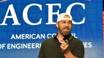 Professional speaker performing live magic trick during keynote presentation