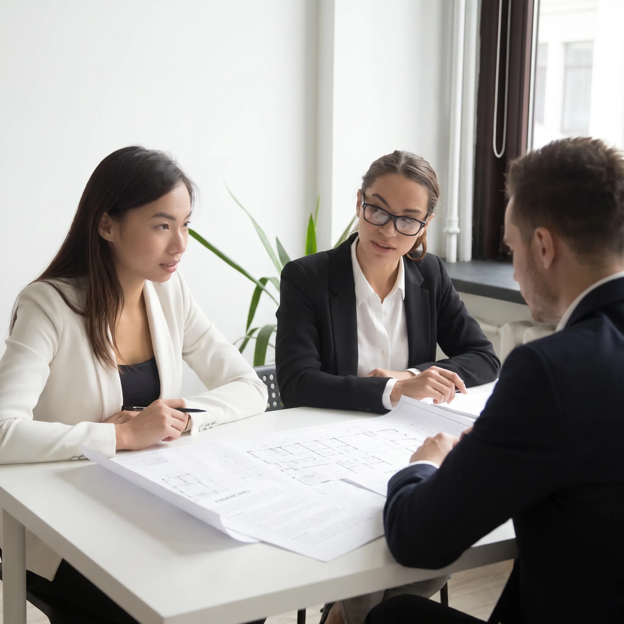 Commercial real estate financing meeting with investor and lending professionals