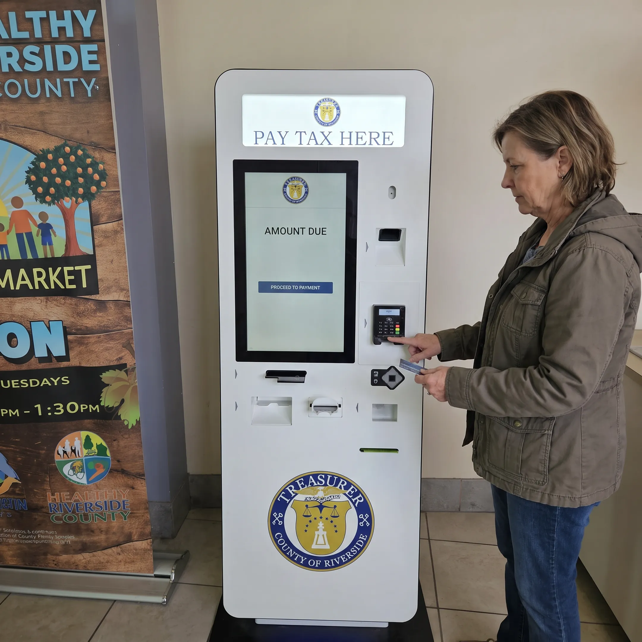 Customer using a secure self-service bill payment kiosk